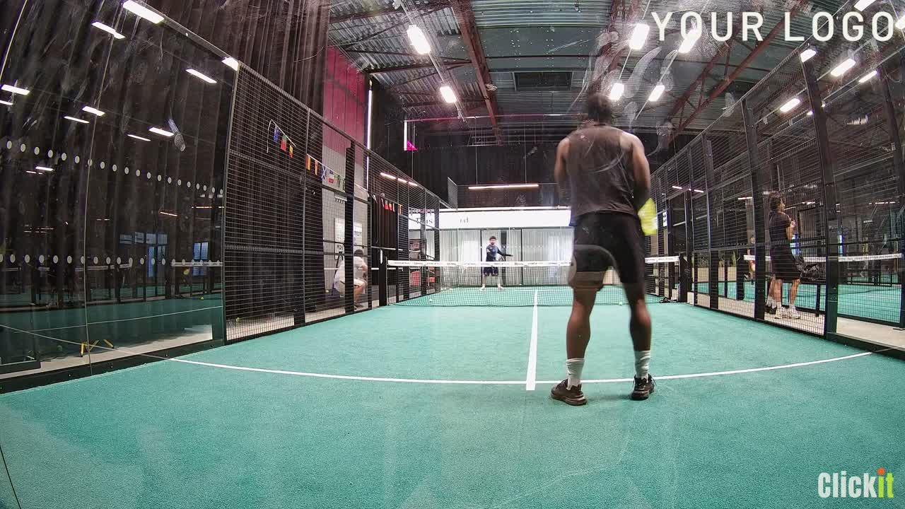 Padel court seen from the Clickit replay camera, with the club logo and Clickit watermark on the clip